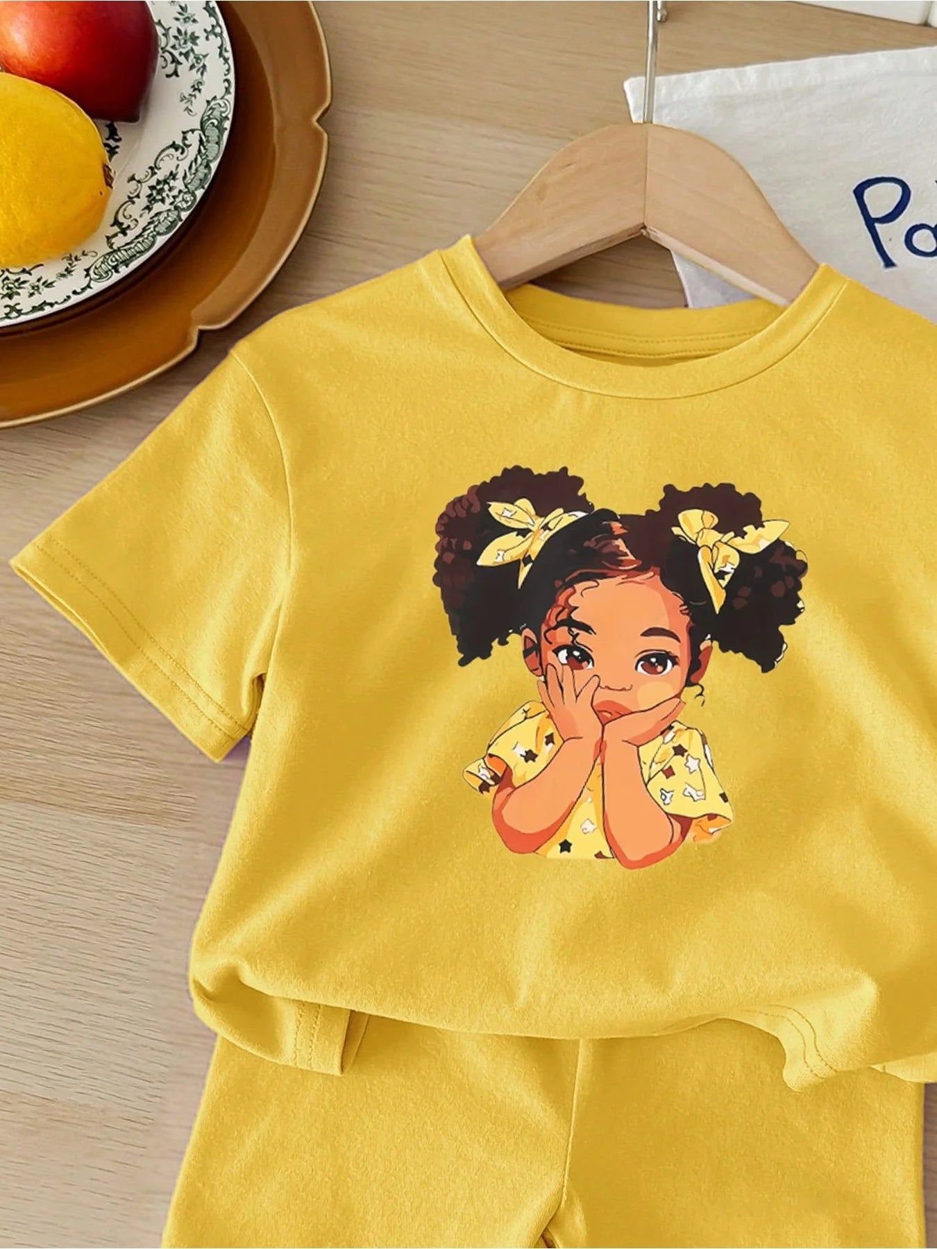 In 2026, casual and comfortable children's clothing featuring cute cartoon designs for little girls includes a yellow printed to